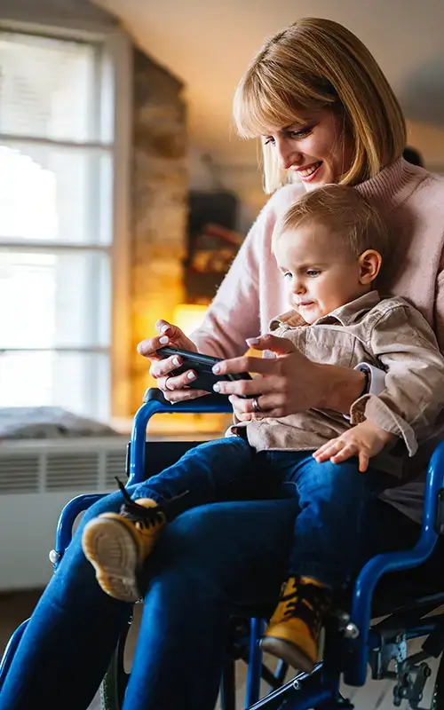 Mother in wheelchair talking to baby
